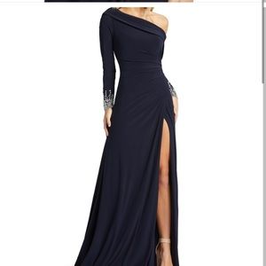 Beautiful navy gown with sexy slit & crystal embellishments.